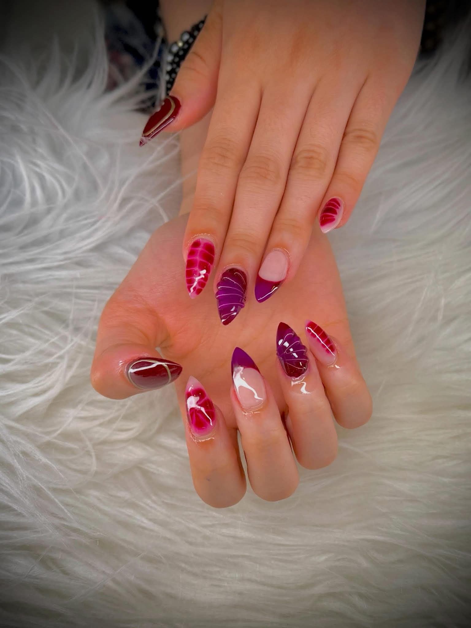 Almond nails marbled in berry, plum and cream