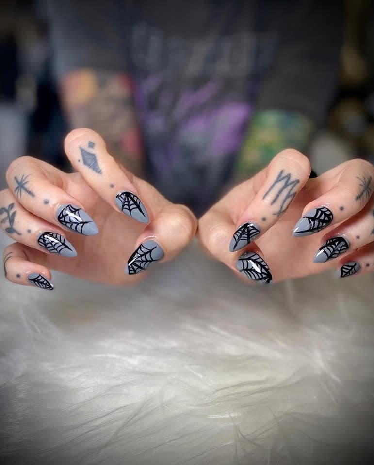 Grey almond nails with hand-painted black spiderwebs