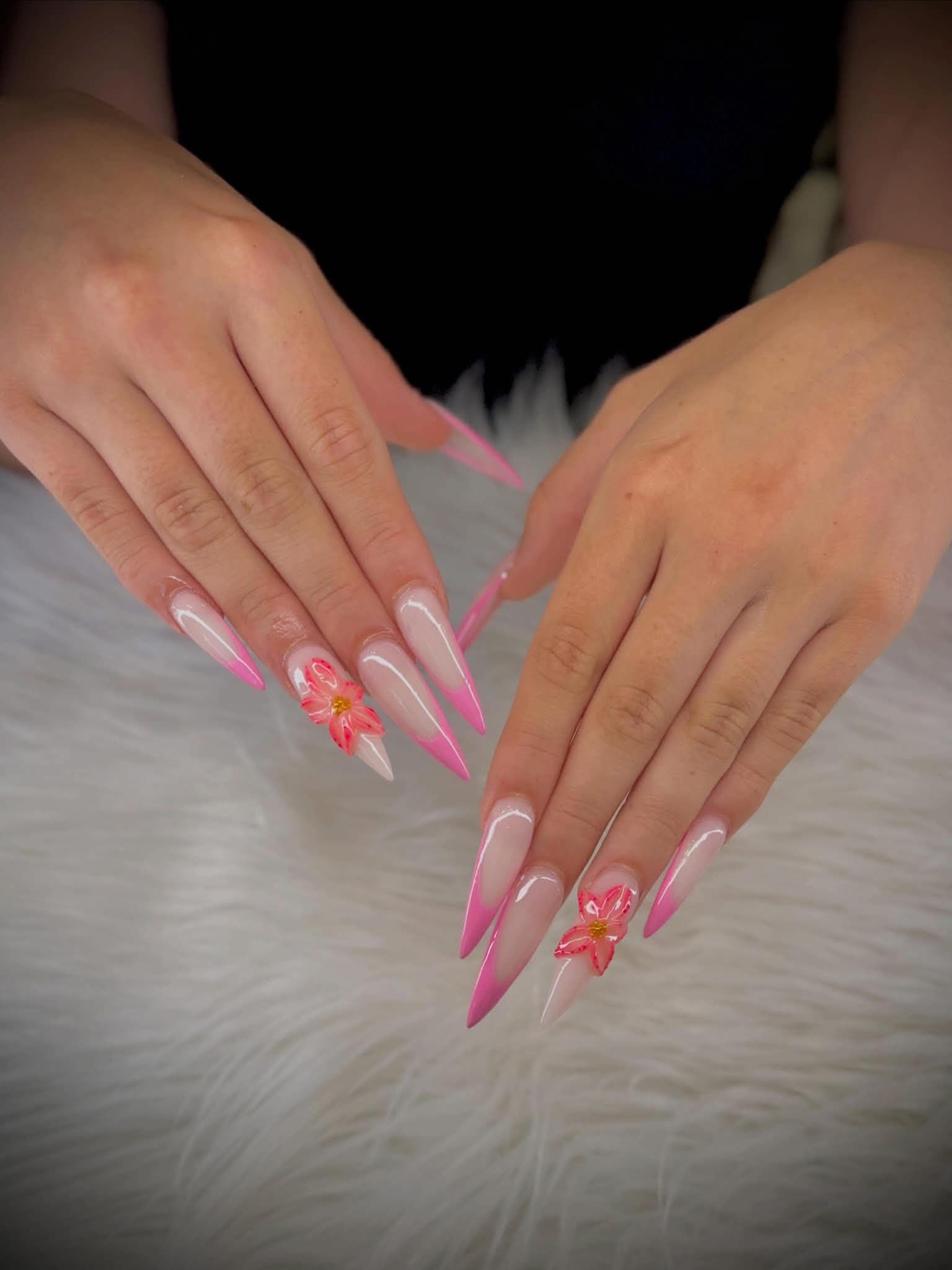 Long stiletto nails in a pink and nude ombré with a hand-sculpted flower